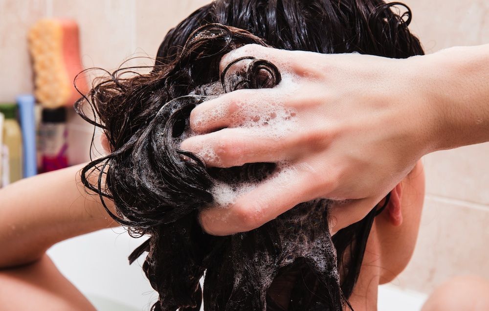woman washing her own hair